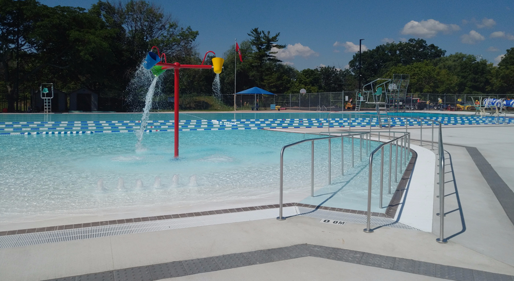 Nelson Pool's outdoor lap/leisure pool with zero depth beach entry and dumping buckets